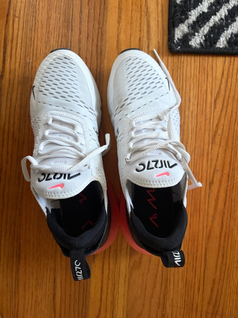 Nike White Running Shoes with Pink and Black Accents